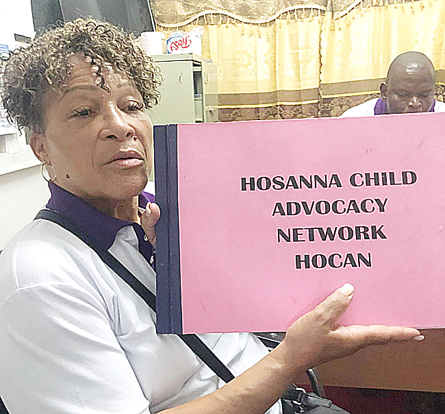 CEO of HOCAN Handing Over Child Safeguard Policy